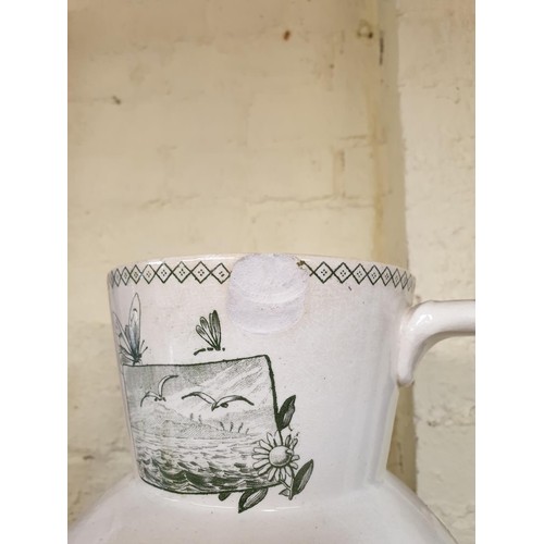 304 - AN ANTIQUE TRANSFER PRINTED DARTMOUTH BH & CO JUG, CHIP TO RIM, TOGETHER WITH A ROYAL DOULTON NORBER... 