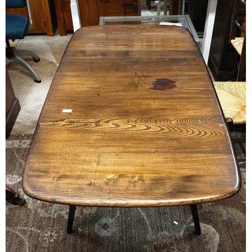 307 - AN ERCOL ELM DROP LEAF DINING TABLE - 54