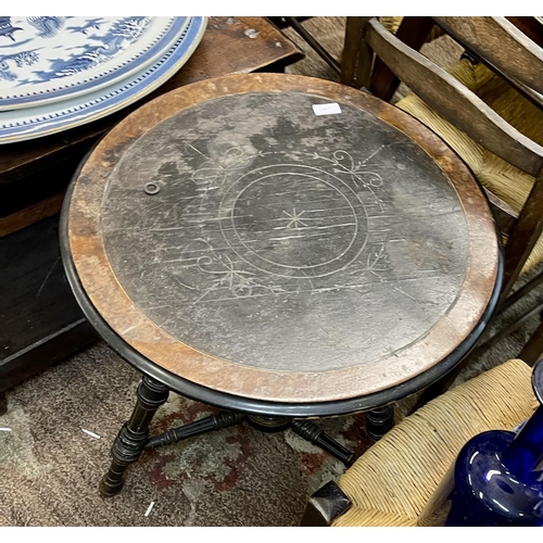 299 - A VICTORIAN CIRCULAR EBONISED TRIPOD TABLE WITH INCISED TOP, WALNUT VENEER TO OUTER EDGES IN THE AES... 