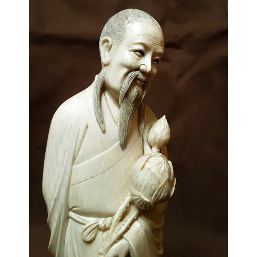 233 - Description: A FINE QUALITY EARLY 20TH CENTURY CHINESE IVORY CARVING OF A SAGE, ON A FIXED WIRE-INLA... 