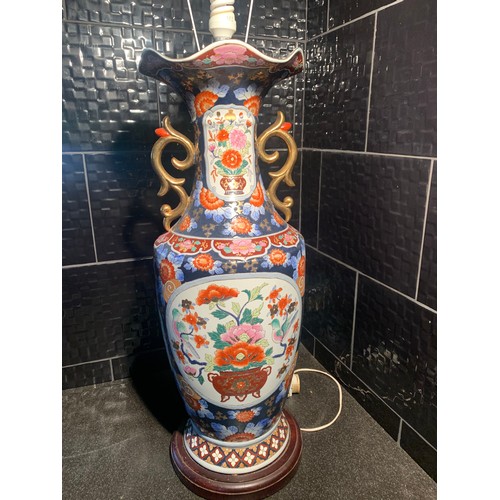 253 - A LARGE CHINESE LAMP & SHADE -PEONY & ROYAL BLUE GROUND PATTERN WITH ORNATE GILDED HANDLES - ON WOOD... 