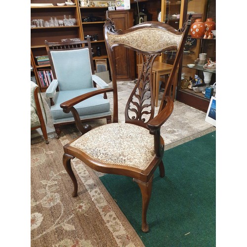 300 - A MAHOGANY SALON OPEN ARMCHAIR CIRCA 1900, THE FISH-TAIL SHAPED AND PADDED TOP RAIL WITH FRETWORK SC... 