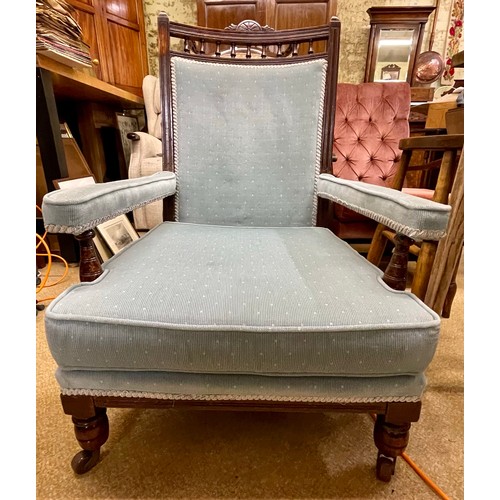 301 - A STAINED AS MAHOGANY LOW ARMCHAIR, VICTORIAN, CIRCA 1870, WITH A MOULDED FRAME, A BALUSTRADE GALLER... 