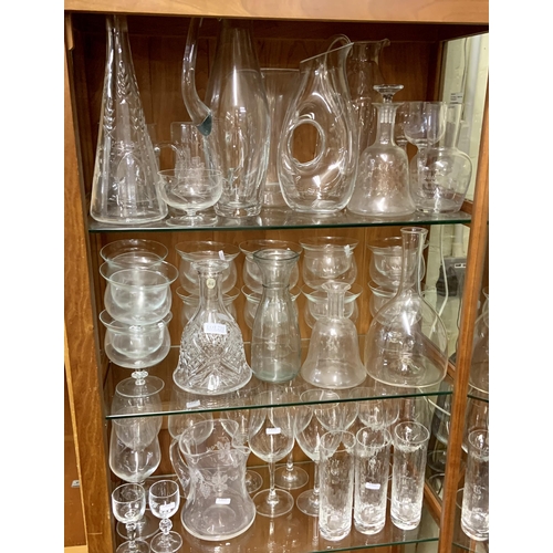 231 - X4 SHELVES OF VARIOUS CUT GLASS AND ETCHED GLASS, INCL BRANDY GLASSES, CHAMPAGNE FLUTES, JUGS, DECAN... 