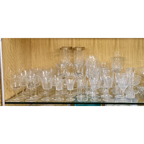 275 - SHELF OF VARIOUS CUT GLASS BRANDY GLASSES, SHERRY GLASSES, CHAMPAGNE FLUTES, ETC...