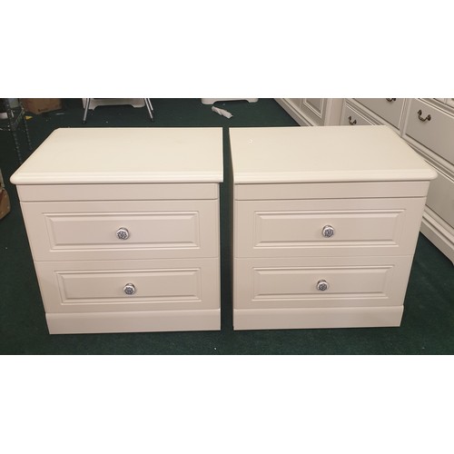 221 - PAIR OF CREME TWO DRAWER BEDSIDE CABINETS WITH ENAMELLED HANDLES