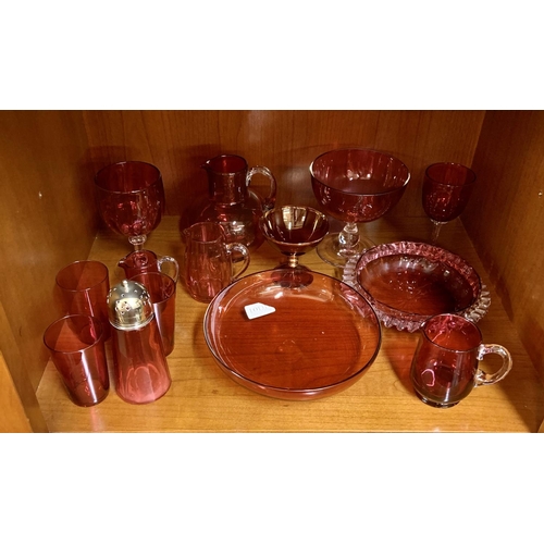 311 - SHELF OF VARIOUS CRANBERRY GLASS ITEMS, INCL JUGS, BOWLS, ETC....