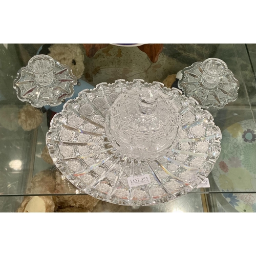 353 - HEAVY CUT GLASS SERVING DISH WITH A MATCHING COVERED BOWL AND A PAIR OF MATCHING CANDLESTICKS