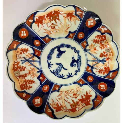 390 - Four Japanese Imari plates, three early 20th century one mid 20th century 22cm D one 25cm D porcelai... 