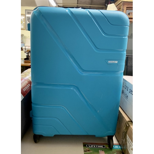 125 - LARGE AMERICAN TOURISTER HARD SHELL SUITCASE IN BLUE