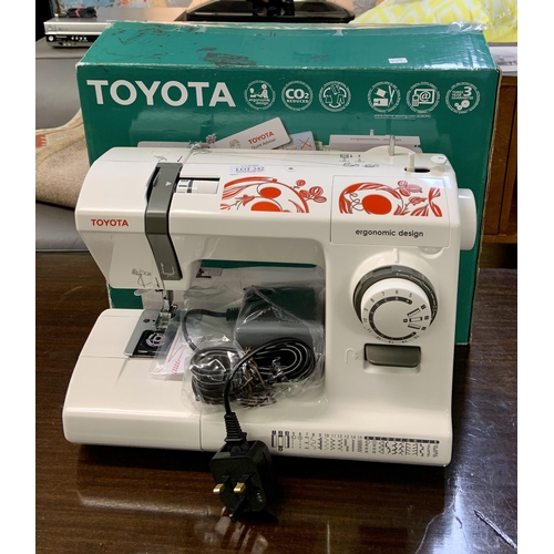 342 - A BOXED TOYOTA ERGONOMIC DESIGN ECO26C ELECTRIC SEWING MACHINE BUILT IN CARRY HANDLE -ALL POWER LEAD... 