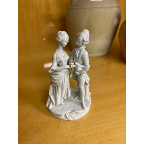 267 - A SMALL CAPO DI MONTE BLANC DE CHINE FIGURINE OF A GENTLEMAN AND LADY