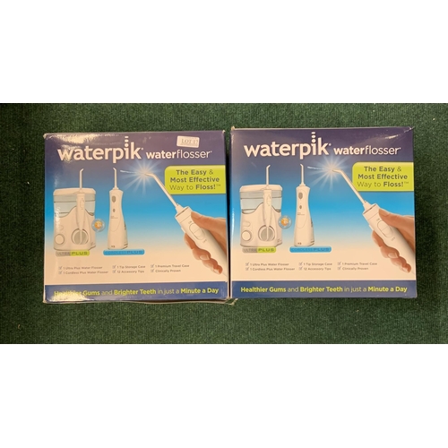 17 - BOXED WATERPIK WATER FLOSSER WITH SPARES