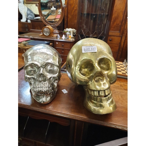 337 - 2 Decorative Skulls - 1 in Resin -silver coloured 5