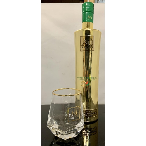 31 - BOTTLE OF AU VODKA GREEN WATERMELON 70CL TOGETHER WITH A COORDINATING AU GLASS