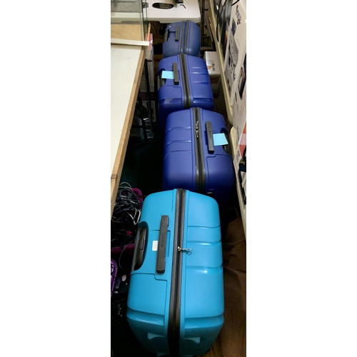 67 - 4 X LARGE AMERICAN TOURISTER HARDSHELL SUITCASES - WITH VARIOUS ZIP FAULTS - BLUES