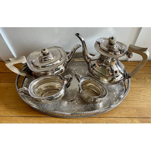 355 - E H PARKIN & CO SILVER PLATED TEA SET: TEA POT, COFFEE POT, CREAM & SUGAR ON AN OVAL CHASED TRAY BY ... 