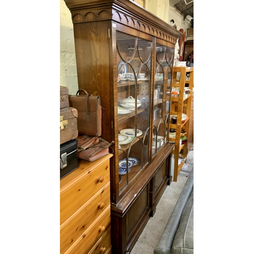 202 - A GLAZED MAHOGANY BOOKCASE OF GLAZED TWIN DOOR CABINET ABOVE CUPBOARD BASE EACH WITH 3 ADJUSTABLE SH... 