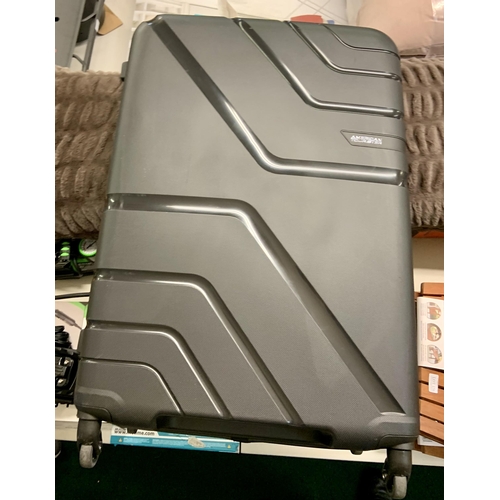 196 - AMERICAN TOURISTER LARGE HARDSIDE SUITCASE - BLACK - SLIGHT TEAR TO INNER LINING