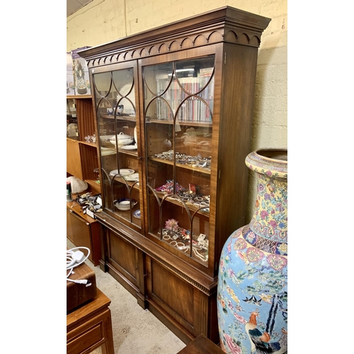 306 - A GLAZED MAHOGANY BOOKCASE OF GLAZED TWIN DOOR CABINET ABOVE CUPBOARD BASE EACH WITH 3 ADJUSTABLE SH... 