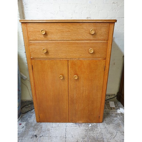 267 - A HEALS STYLE LIGHT OAK 1960'S TALL BOY OF 2 DRAWERS ABOVE DOUBLE DOOR CABINET BASE