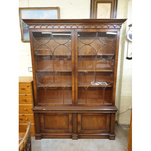 306 - A GLAZED MAHOGANY BOOKCASE OF GLAZED TWIN DOOR CABINET ABOVE CUPBOARD BASE EACH WITH 3 ADJUSTABLE SH... 