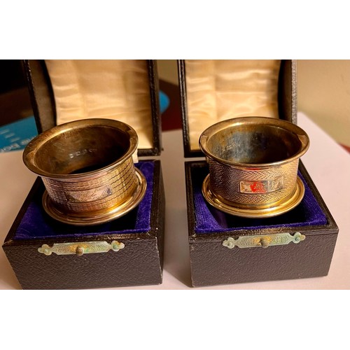 308 - A PAIR OF CASED SILVER NAPKIN RINGS