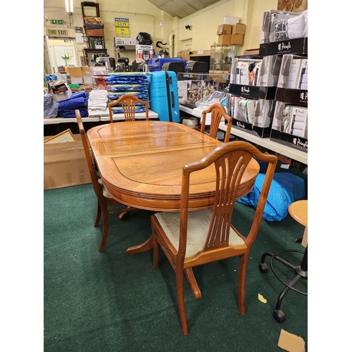 272 - A TEAK OVAL EXTENDING DINING TABLE ON PEDESTAL LEGS WITH REMOVABLE CENTRAL LEAF &  4 CHAIRS TO MATCH... 