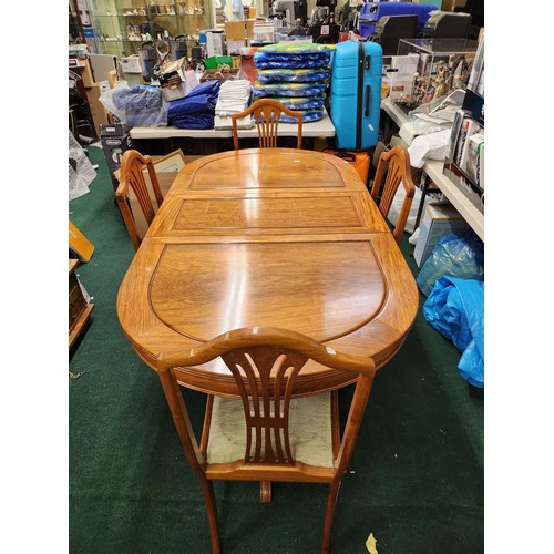 272 - A TEAK OVAL EXTENDING DINING TABLE ON PEDESTAL LEGS WITH REMOVABLE CENTRAL LEAF &  4 CHAIRS TO MATCH... 