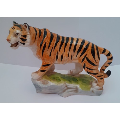 219 - Vintage hand painted pottery figure modelled as a tiger. Probably Sitzendorf, 12cm (height), 16cm (l... 