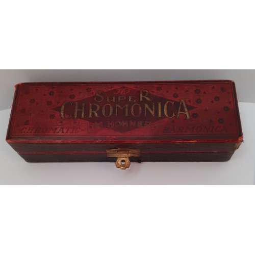 226 - A vintage boxed super Chromonica made by M.Hohner, 15cm in length No 260 ½