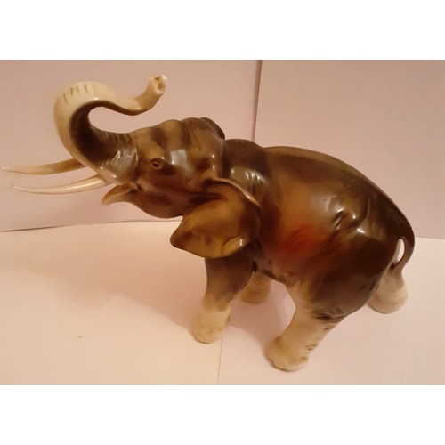 236 - Mid 20c ceramic hand painted “royal dux” figure of a elephant, 24cm height – 22cm in length, pink tr... 