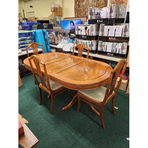 346 - A TEAK OVAL EXTENDING DINING TABLE ON PEDESTAL LEGS WITH REMOVABLE CENTRAL LEAF &  4 CHAIRS TO MATCH... 