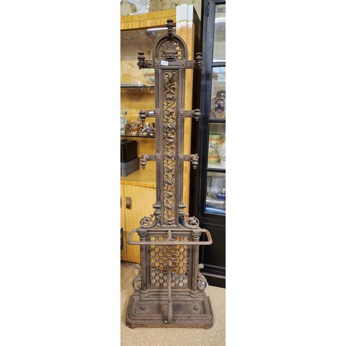 425 - A VICTORIAN CAST IRON HALL STAND WITH GREEN MAN MOTIF APPROX 180CM HIGH 58CM WIDE AND 25CM DEEP