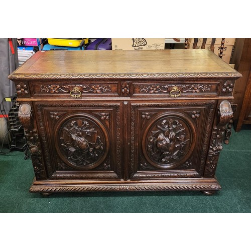 317 - A HEAVILY CARVED CONTINENTAL (POSS. FRENCH) OAK BUFFET SIDEBOARD BASE OF 2 DRAWERS & 2 DOOR CUPBOARD... 