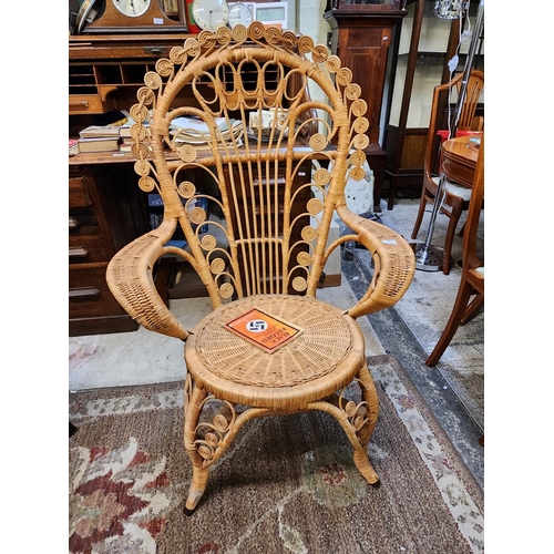 333 - A VINTAGE RATTAN HI-BACK ARMCHAIR