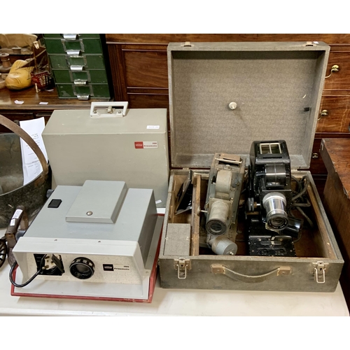 A VINTAGE GREY METAL PROJECTOR - LENS MARKED LEECH 0861 TOGETHER WITH ...