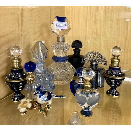 394 - A COLLECTION OF BLUE COLOURED SCENT BOTTLES - 9 IN TOTAL, ONE WITH SILVER COLLAR