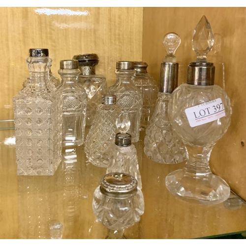 397 - 11 X VINTAGE AND ANTIQUE SCENT BOTTLES MOST WITH SILVER COLLARS, SOME MISSING STOPPERS