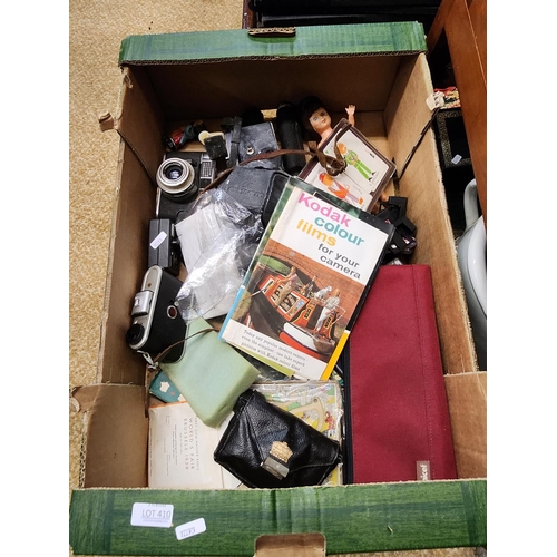 410 - A BOX OF MISCELLANEOUS ITEMS INC. CAMERAS, ROBERTSON JAM FIGURES, GAMES ETC.