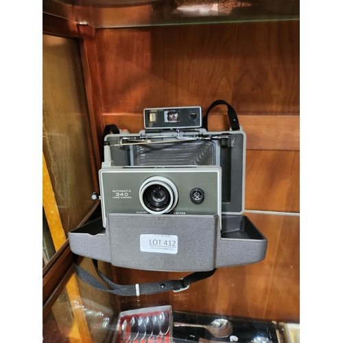 412 - A POLAROID AUTOMATIC 340 LAND CAMERA (BELLOWS TYPE)