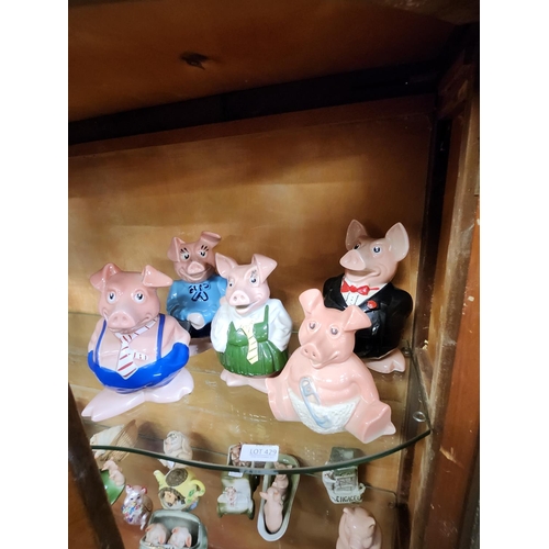 429 - A SET OF WADE NAT WEST PIG FAMILY MONEY BOXES, WITH THE NAT WEST STOPPERS