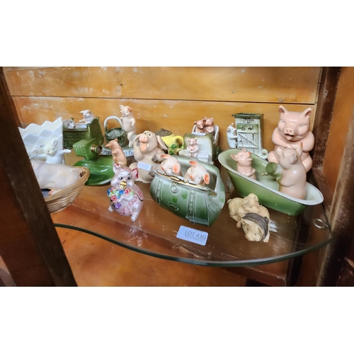 430 - A SHELF OF VINTAGE AND MODERN PIG FIGURES INC. FAIRINGS, ETC