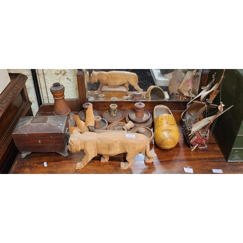 434 - TREEN WARES INC. A COVERED ANTIQUE CADDY, VARIOUS WOODEN CANDLESTICKS, CLOG AND AN ANIMAL FIGURE