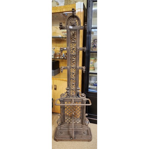 425 - A VICTORIAN CAST IRON HALL STAND WITH GREEN MAN MOTIF APPROX 180CM HIGH 58CM WIDE AND 25CM DEEP