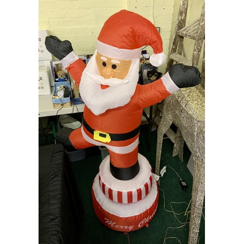 232 - BOXED ROMAN CONRAD INFLATABLE SANTA ON SPINNING PLINTH WITH BUILT IN PUMP