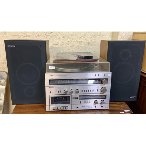 242 - SANYO UMC 9003 STEREO SYSTEM (TURNTABLE, TUNER, AMP, TAPE DECK AND 2 X SANYO SPEAKERS) WITH SMALL CO... 