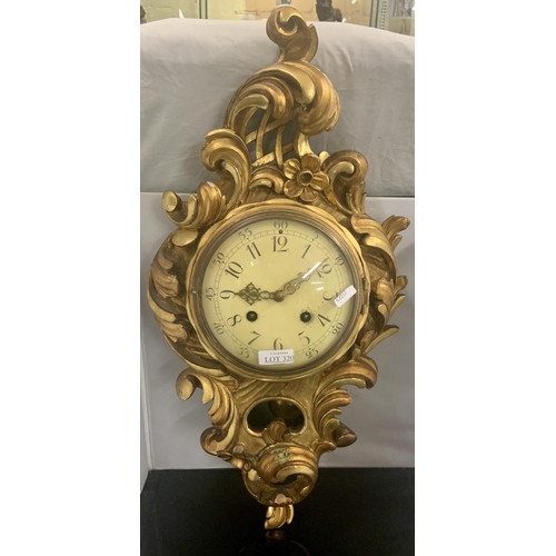 320 - A GILTWOOD ROCOCCO STYLE CARTEL CLOCK WITH GILT HANDS MARKED WESTROOD TOREBODA