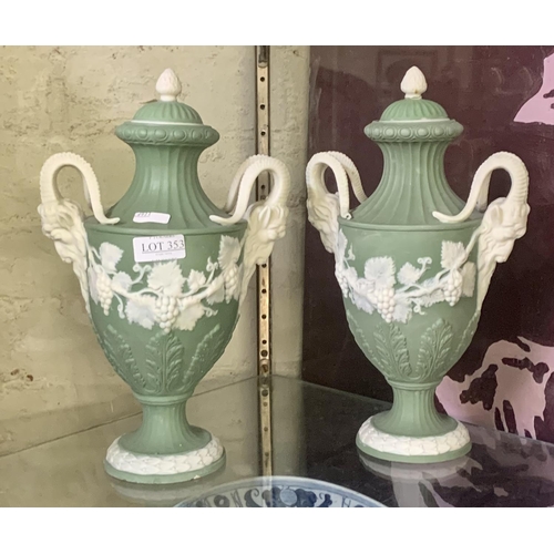 353 - A PAIR OF ADAMS STYLE JASPERWARE URNS IN GREEN & WHITE - RAMS HEAD HANDLES, ACORN FINIALS -GRAPE & V... 