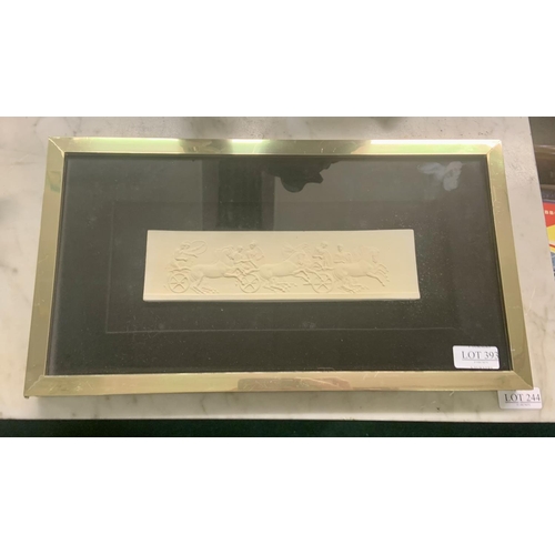 393 - A FRAMED AND GLAZED PARIAN WARE PLAQUE - A REPLICA OF THE ELGIN MARBLES